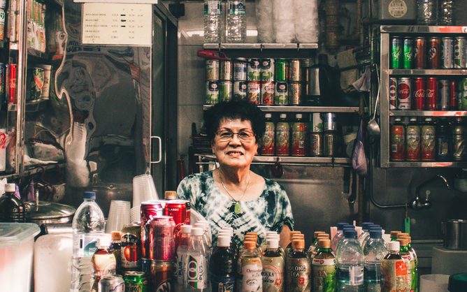 A stallholder at her drink stall in a Singapore hawker centre.